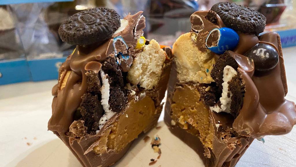 Giant Pb Cup: Cookie Monster! · A giant (the size of a cupcake), milk chocolate, creamy peanut butter cup, loaded with golden and classic Oreo cookies, drizzled in more chocolate and topped with M&M’s and Mini Oreos! YUM!! Made by 4am Candy Co. in Broooklyn!