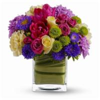 Teleflora'S One Fine Day · Light yellow roses, hot pink spray roses, tulips and gerberas, yellow carnations, green butt...