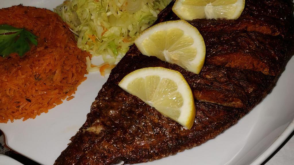 Red Snapper · One whole red snapper fish seasoned, pan-seared, slow baked in an air-dry-heat oven, then served with a mixed vegetables and special spices.