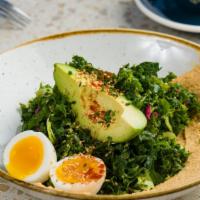 Brassicas Bowl · Charred broccolini, brussels sprouts, kale, hummus, soft boiled egg, avocado, pickled shallo...