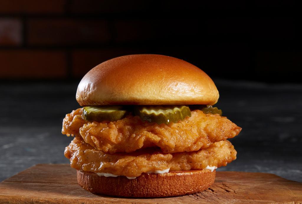 Southern Chicken Sandwich · Hand-dipped Chicken Breasts, Crunchy Pickle Chips, and Mayo on a Potato Brioche Bun. All sandwiches served as doubles.