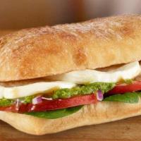 Caprese Ciabatta Sandwich · Baby Spinach, Pesto, Tomato Slices and Fresh Mozzarella Cheese on a Ciabatta Bread