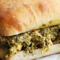 Grilled Chicken Pesto Panini · Grilled chicken breast, fresh mozzarella pesto sauce, garlic, and olive oil on a grilled pan...