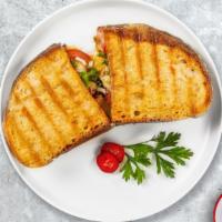 On The Grill Chicken Panini · Grilled chicken, mozzarella, broccoli rabe, and roasted peppers served on toasted bread.