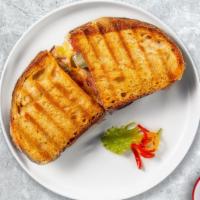 Mozzarella On Pepper Panini · Mozzarella and roasted peppers served on toasted bread.