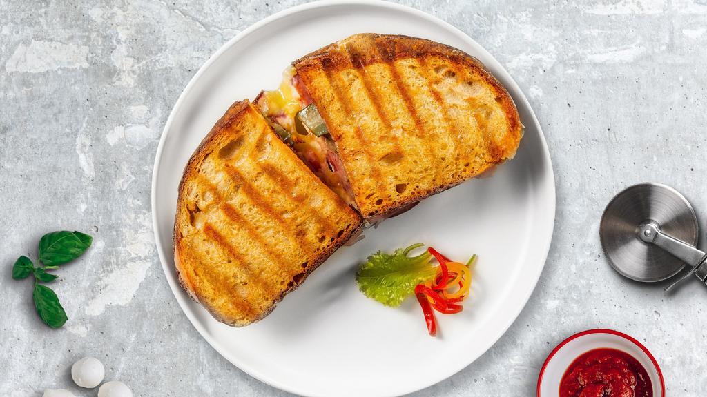 Mozzarella On Pepper Panini · Mozzarella and roasted peppers served on toasted bread.