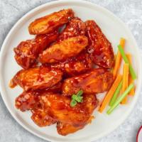 Buffalo Chicken Wings · Fresh chicken wings breaded, fried until golden brown, and tossed in buffalo sauce. Served w...