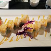Magnet Roll · Cooked shrimp, avocado, and cucumber inside, topped with spicy scallop, spicy mayo and bonit...