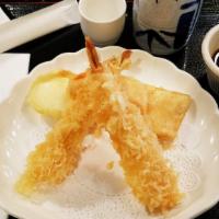 Tempura Appetizer · Deep fried shrimp and mixed vegetables served with tempura sauce.