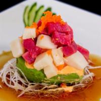 Treasure Island · Mixed raw fish served on top of halved avocado served with spicy mayonnaise and ponzu sauce.