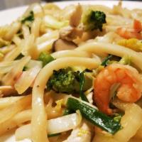 Yaki Udon · Sautéed udon noodles with shrimp, fishcakes, chicken, mushrooms, and vegetables.