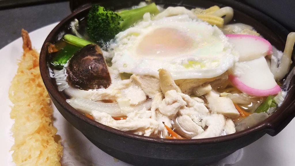 Nabeyaki Udon · Big bowl of udon, noodles soup with chicken, egg, fishcakes, vegetable, and one piece of shrimp tempura.