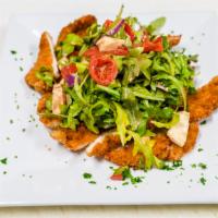 Chicken Milanese · Chicken Cutlets over Arugula, Tomatoes, Red Onion, and Mozzarella with Lemon Olive Oil Vinai...