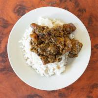 White Rice & Stew · An African dish composed of white rice and assorted meat stew. Assorted meat stew includes t...