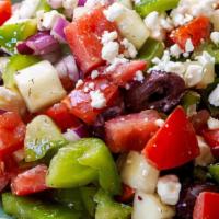 Greek Salad · Lettuce, tomato, onions, feta cheese, olives