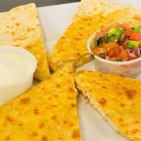 Chicken Quesadilla · Flour tortilla with grilled chicken, a portion of melted three-cheese blend, sour cream and ...