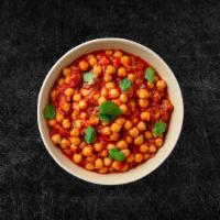 Chickpea Potato Masala (Vegan) · Whole chickpeas and potatoes, slow cooked in an onion and tomato curry sauce with Indian who...