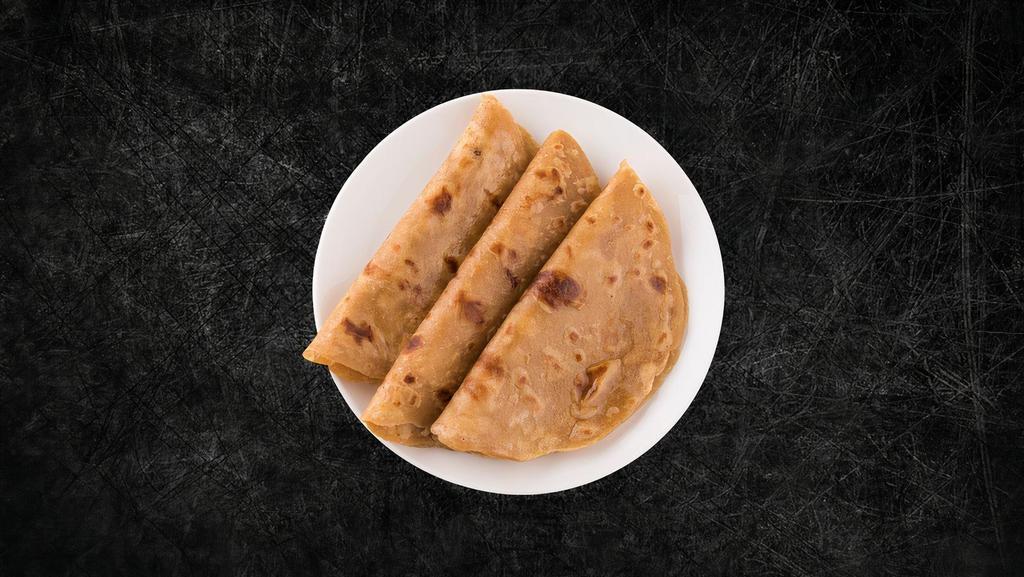 Plain Paratha(Vegan) · A whole wheat flat bread, baked on a pan.