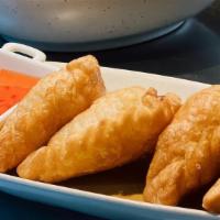 Curry Puff · With cucumber salad.