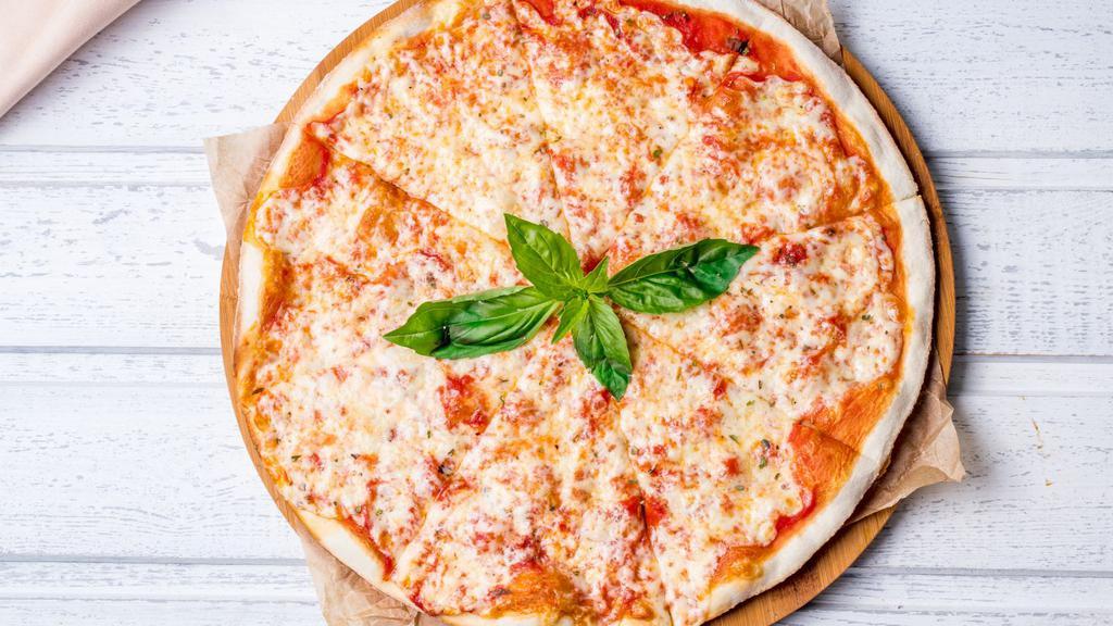 Margherita Pizza · Features a thin and crispy crust with marinara sauce, fresh tomatoes, fresh garlic, Buffalo sauce, mozzarella cheese & fresh basil.