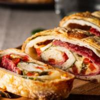 Stromboli · Turnover pizza filled with different styles of cheeses and other house specials.