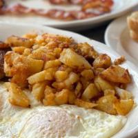 2 Eggs · With bacon, ham, sausage, or turkey bacon served with home fries and toast.