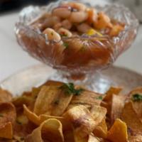 Valencia Ceviche · Shrimp, onion, cilantro, lime juice. served with plantain chips.