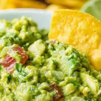 Guacamole With Chips · Avocado, cilantro, tomato, lime, onions. served with plantain chips.