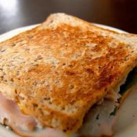 Popeye'S Cuban Sandwich · Ham, cheese, spinach, garlic aioli. and a canned drink