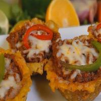 Tostones Rellenos · Fried plantains topped with your choice of shrimp, ground beef, or chicken.