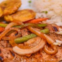 Grilled Chicken (Pechuga A La Plancha) · Grilled chicken breast with sautéed onions and peppers served with two sides.
