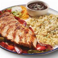 New! Chicken Fajitas · Grilled chicken seasoned with our special blend of Mexican spices.  Served on a bed of grill...