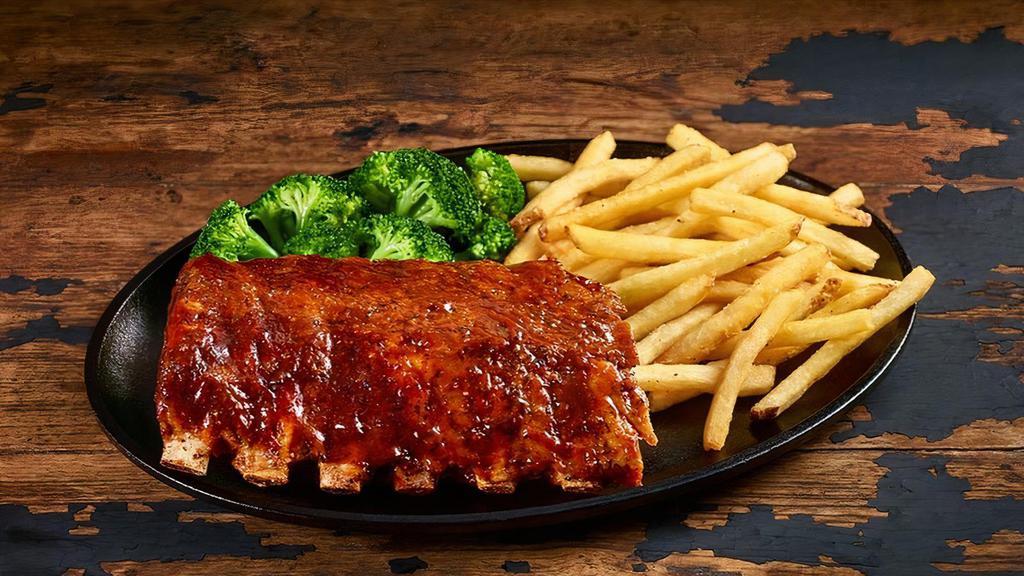 Half-Rack Baby-Back Ribs · Slow-cooked for hours until they fall off the bone. Choose Classic Barbecue, Hickory Bourbon, Nashville Hot, or Texas Dusted dry rub. Served with your choice of two sides.