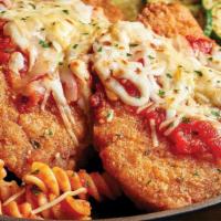 Chicken Parmesan · Two breaded chicken breasts with marinara and melted mozzarella.  Served with your choice of...
