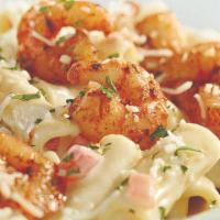 Parmesan Shrimp Pasta · Spicy sautéed shrimp over penne in Parmesan cream with tomatoes. Served with 4 Breadsticks.