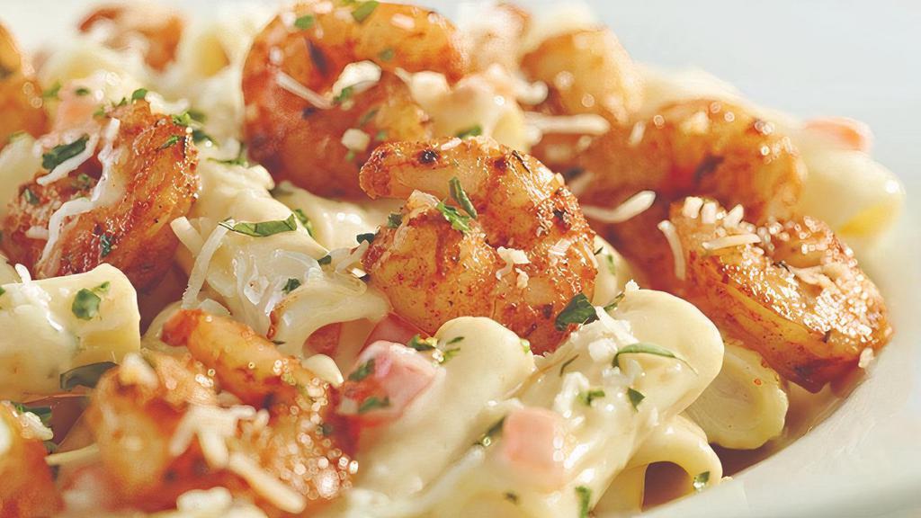 Parmesan Shrimp Pasta  · Spicy sautéed shrimp over penne in Parmesan cream with tomatoes. Served with a breadstick.
