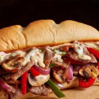 Philly Cheesesteak Hoagie · Tender, shaved beef grilled with peppers, onions, and mushrooms all topped with cheddar chee...