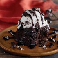 Chocolate Lava Cake · Warm chocolate cake with a dark chocolate center topped with vanillla bean ice cream, Oreo® ...