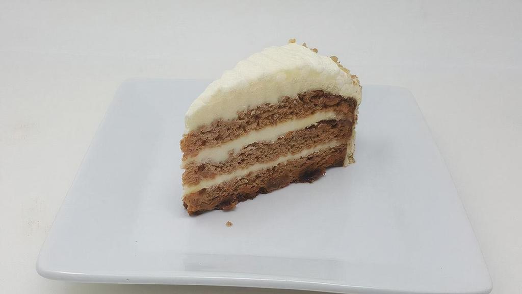 Carrot Cake · Triple layered with walnuts and cream cheese icing.