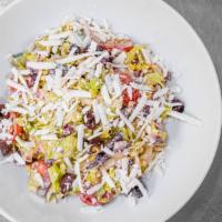 Chopped Salad,  Lettuce, Tomatoes Radishes, Corn ,Heart Of Palm, Ricotta Salata, Oregano Vinaigrette · 