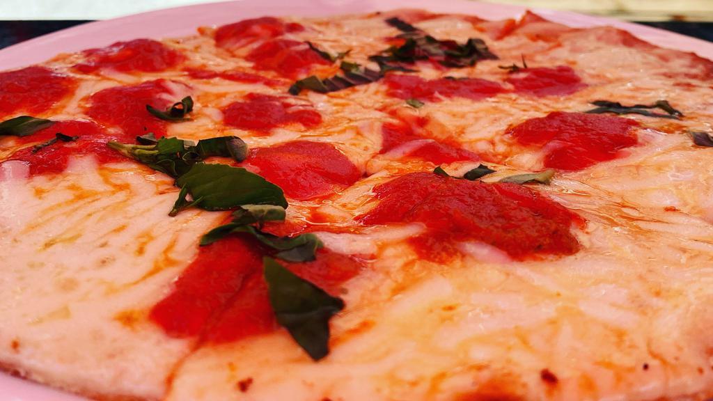 Margherita Flatbread Pizza · Fresh san marzano tomato sauce, garlic, sliced roma tomatoes, mozzarella and fresh basil.