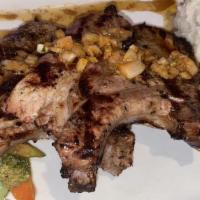 Grilled Pork Chops  · Grilled marinated pork chops, Roasted potatoes, Mixed vegetables.
