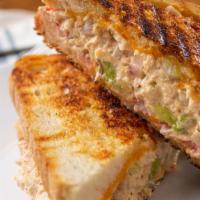 Tuna Melt Panini · Delicious Panini made with fresh Tuna Salad, Cheddar cheese, lettuce, and tomato. Served on ...