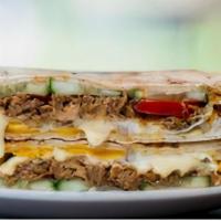 Torino Panini · Grilled Panini Sandwich made on a European Flatbread, and topped with Breaded chicken, mozza...