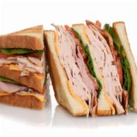 Turkey Club Panini · Grilled Panini Sandwich made on a European Flatbread, and topped with Turkey, bacon, pepper ...