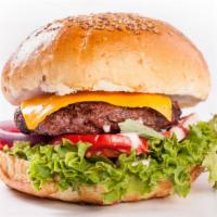 Hamburger · Juicy, grilled beef patty with fresh lettuce, tomatoes and onions with pickles on a soft bun.