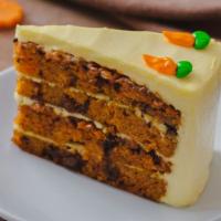 Carrot Cake · Moist cake, filled with spiced walnuts and golden raisins and frosted with cream cheese.
