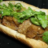 Thit Bo Satay Sandwich · Beef flank in satay and peanut sauce with onions.
Served with mayo, cucumbers, cilantro, jal...