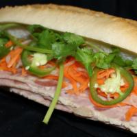 Thit Nguoi Sandwich · Vietnamese ham and pate.
Served with mayo, cucumbers, cilantro, jalapenos, pickled carrots a...