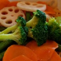 Vegetable Ramen · Miso broth, mixed vegetables, lotus, mushroom, corns, carrots, broccoli  and scallions.
